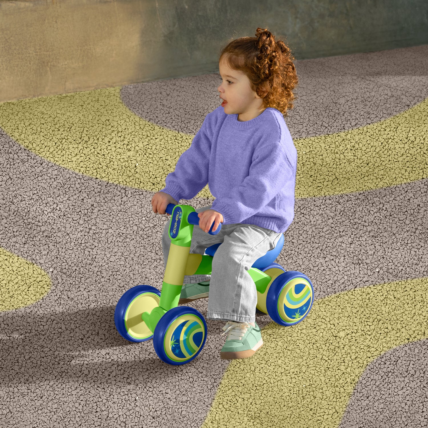 little kid riding blue bounce balance bike