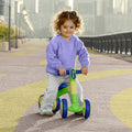 little kid sitting on bounce balance bike