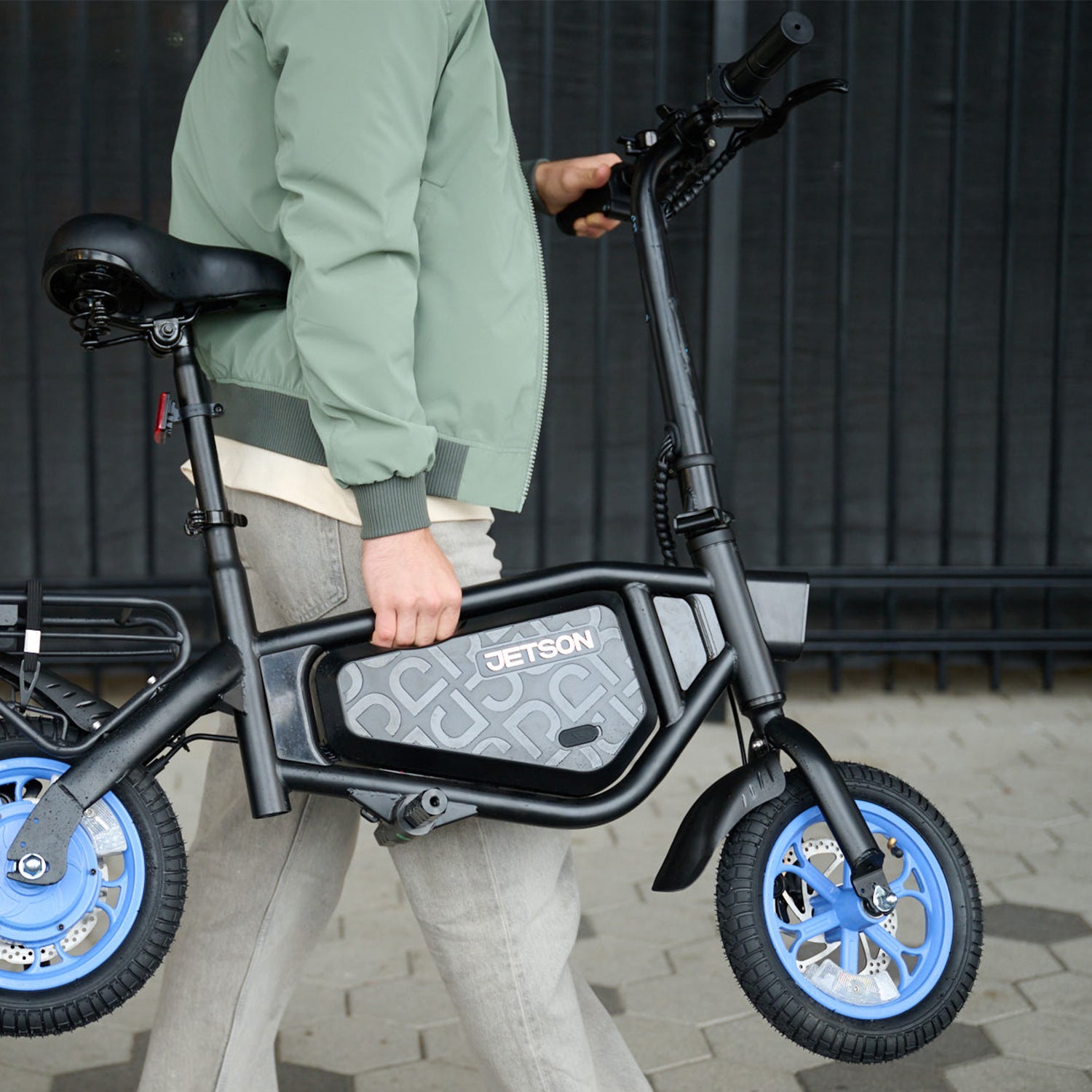 person carrying bolt x electric bike