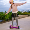 young girl riding hoverboard