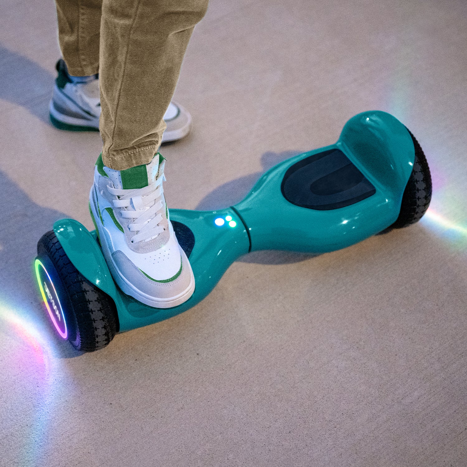 close up of kid putting foot on hoverboard