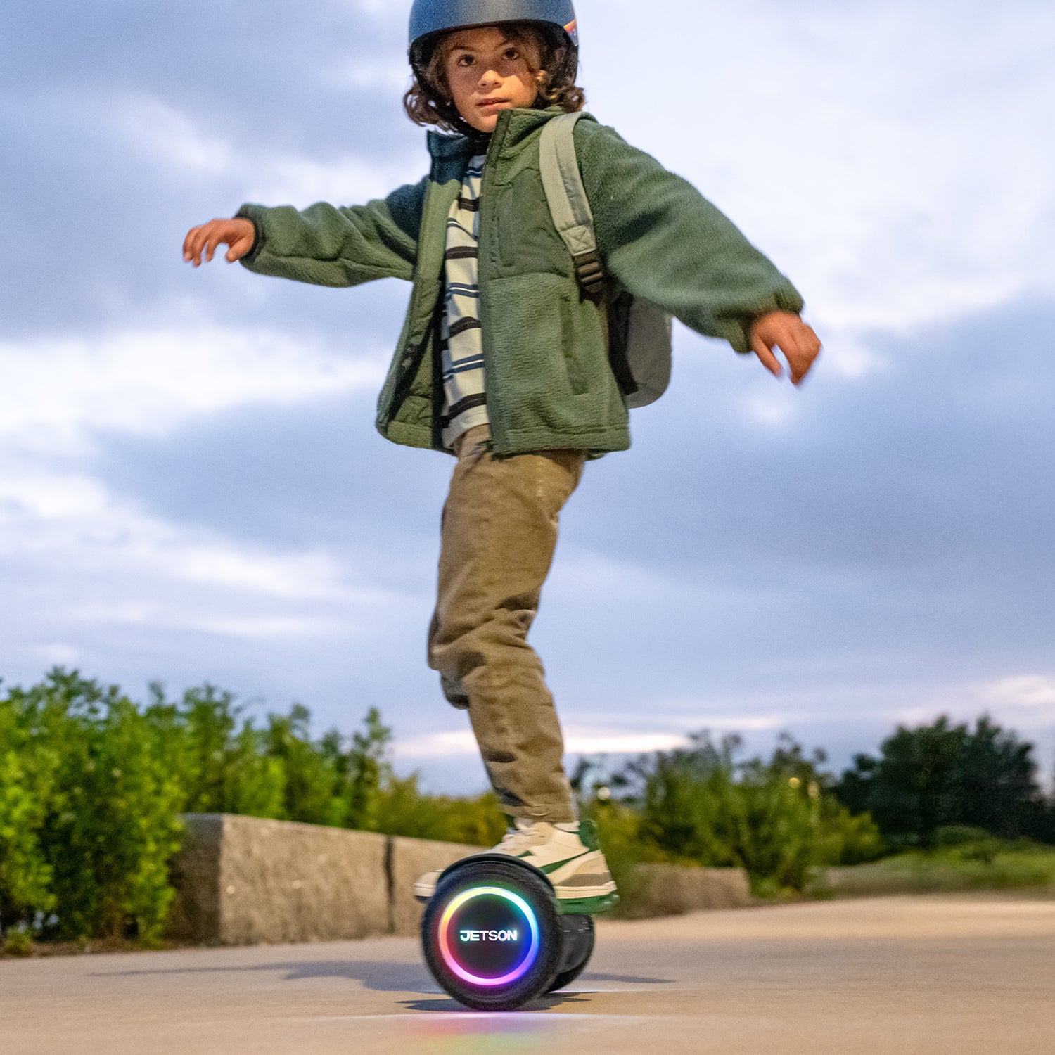 young kid riding hoverboard