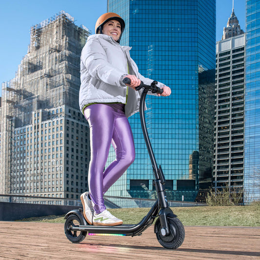 woman riding ember e-scooter