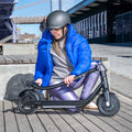 person folding handlebar on ember electric scooter