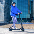 person riding ember electric scooter