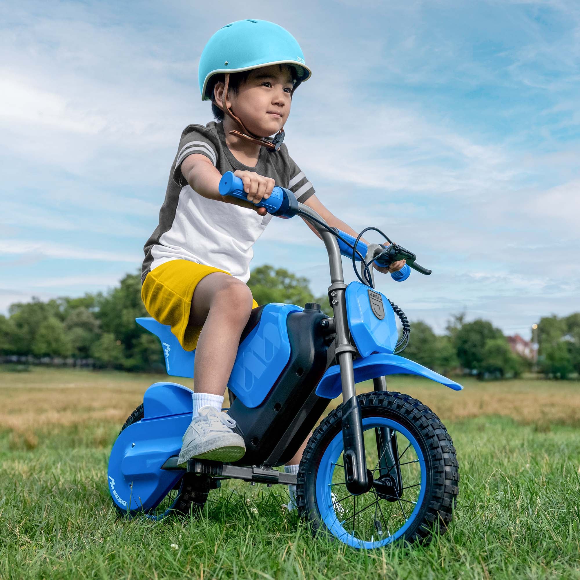 kid wearing a helmet sitting on fort electric ride on
