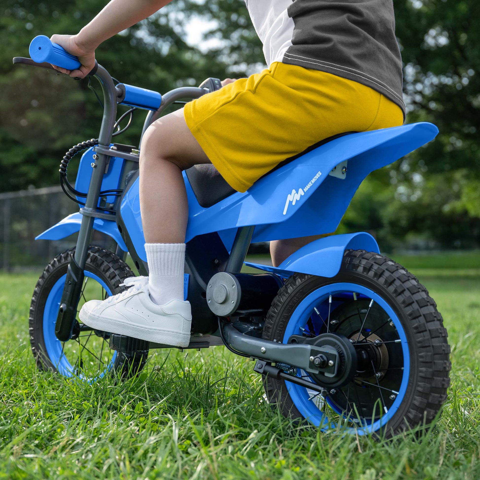 close up of kid sitting on fort electric ride on
