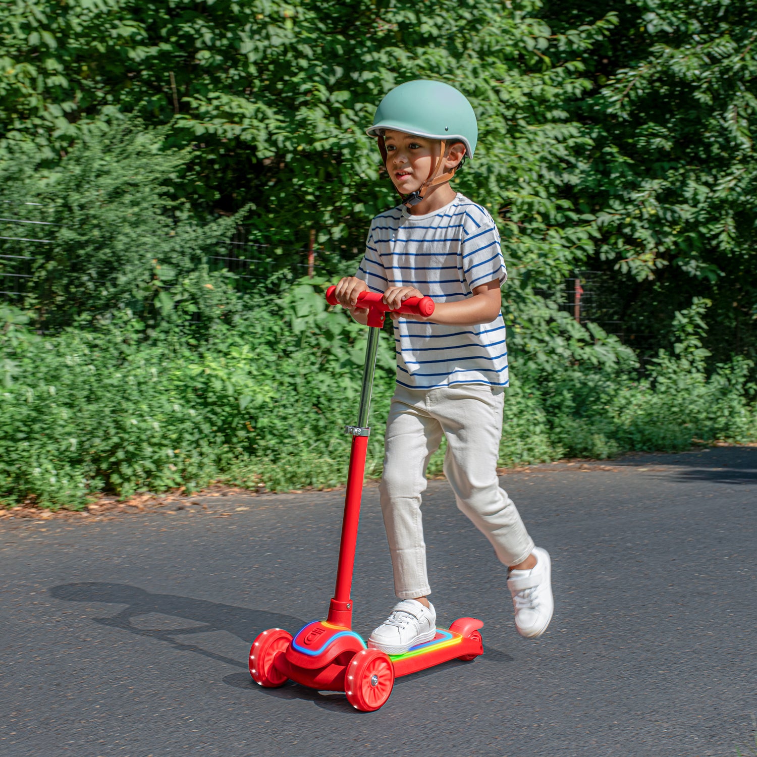 young kid riding halos kick scooter