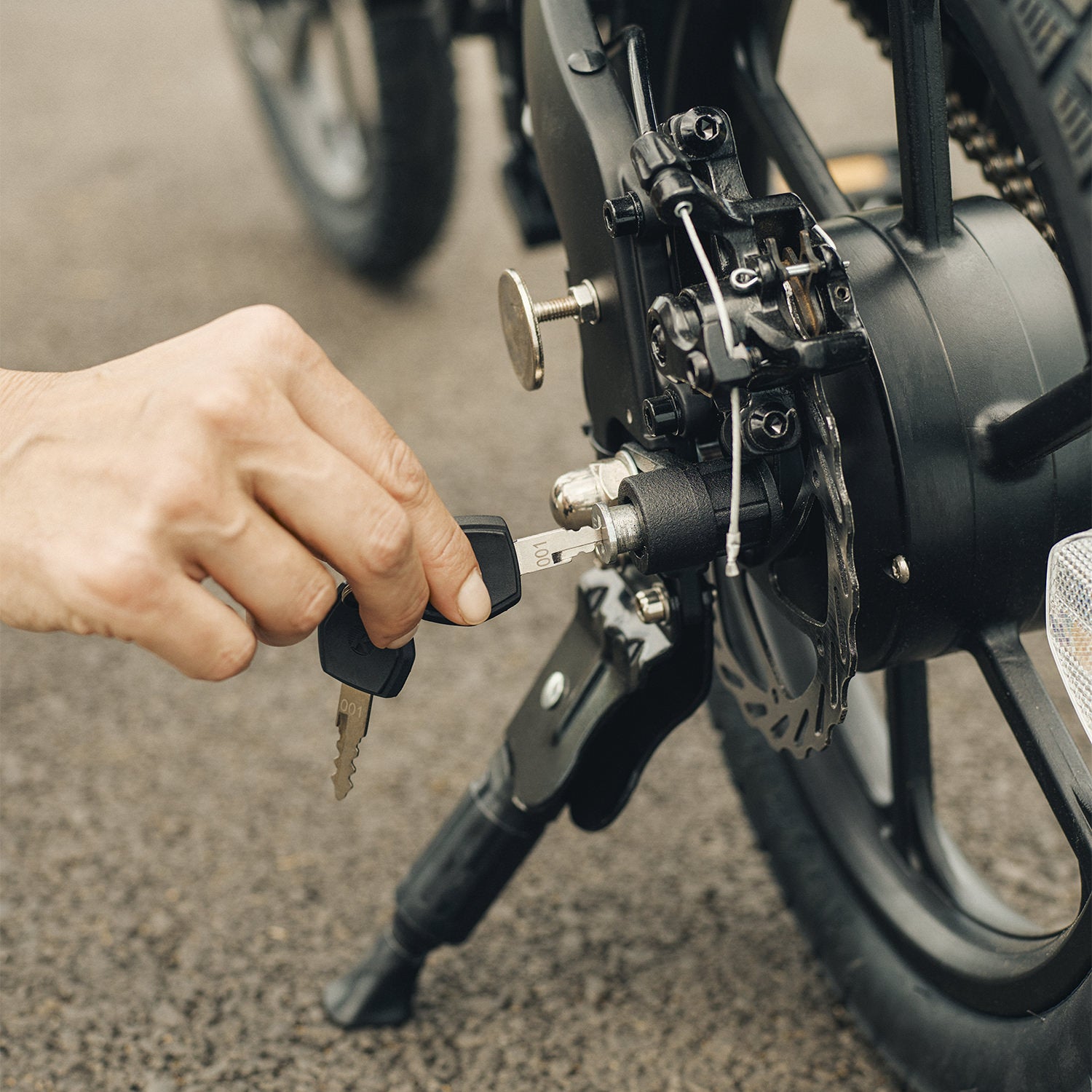 person locking their haze electric bike