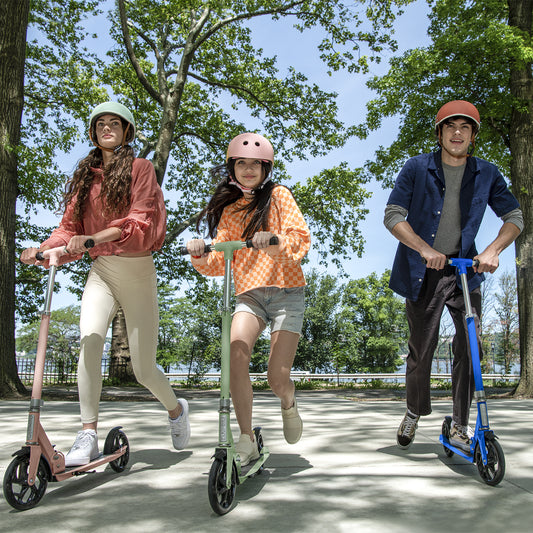 three kids riding their hex kick scooters