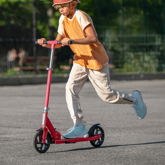 kid riding red hex kick scooter