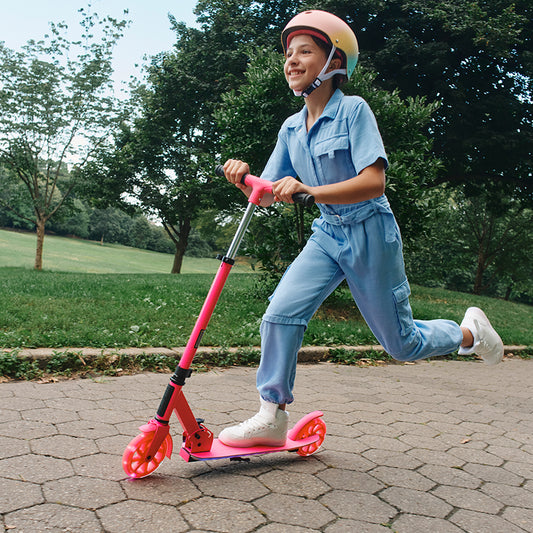 girl riding pink highlight scooter