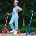 girl posing with blue and pink highlight scooters