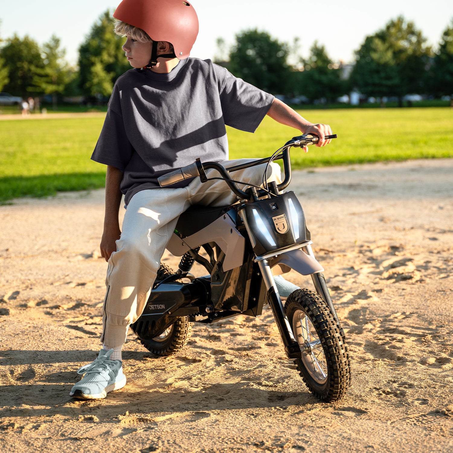 young kid sitting on horizon x with headlight on