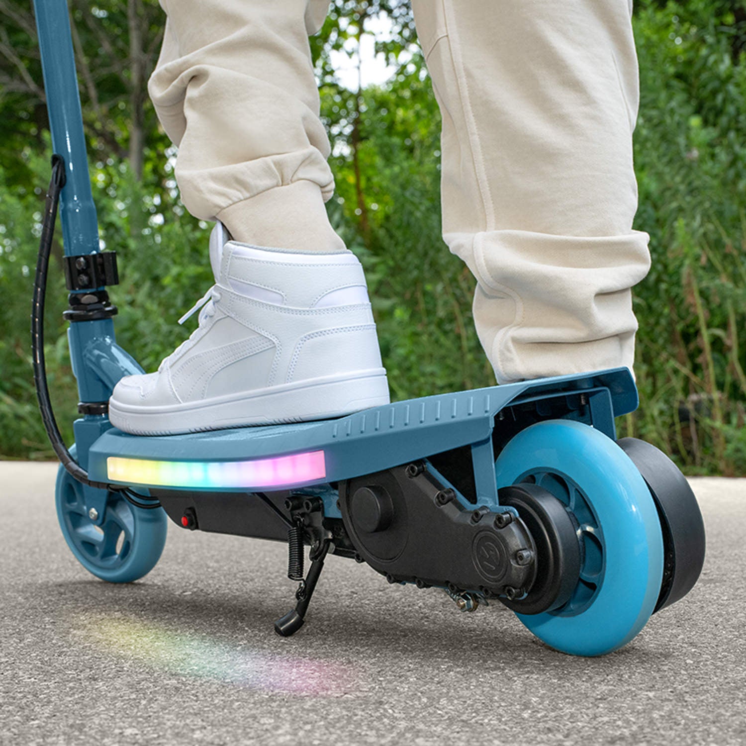 close up of rear wheel and deck on blue joust electric scooter 