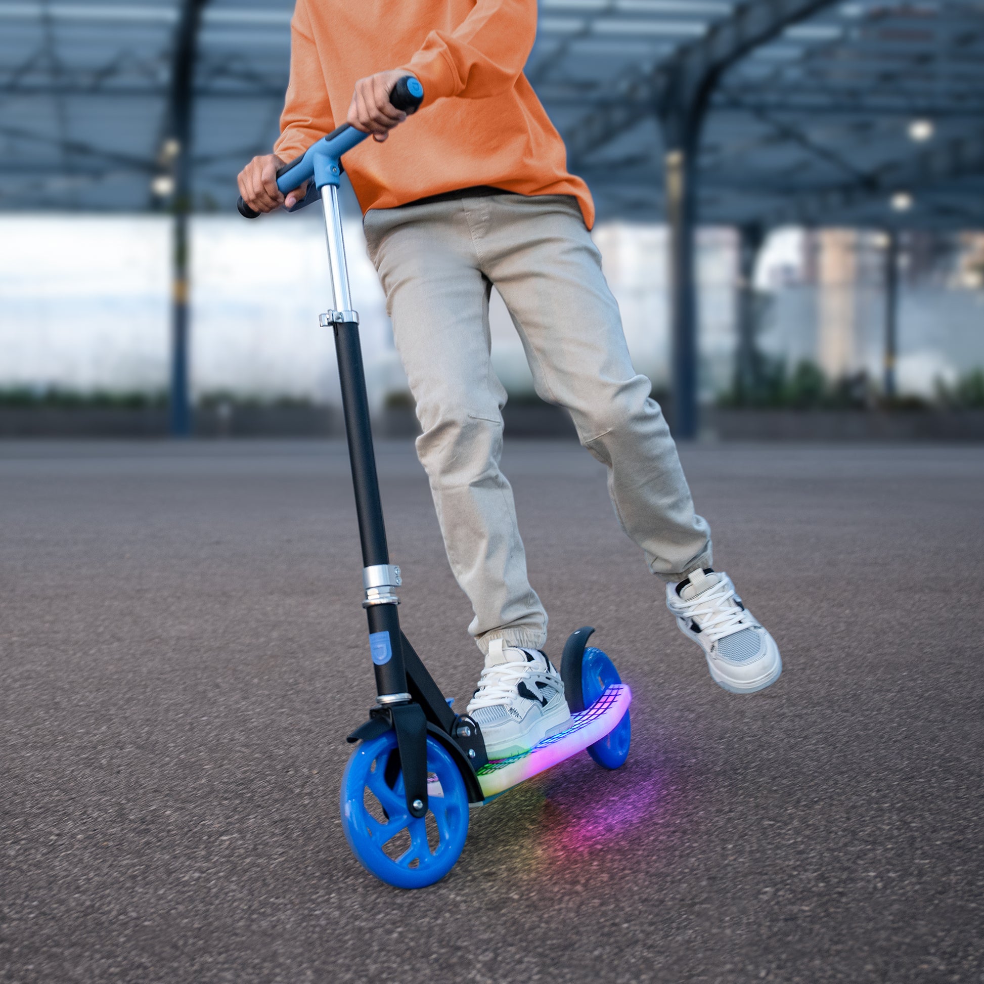 kid riding J-Ray kick scooter