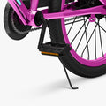 close up of pedal and kickstand on metallic pink light rider 20