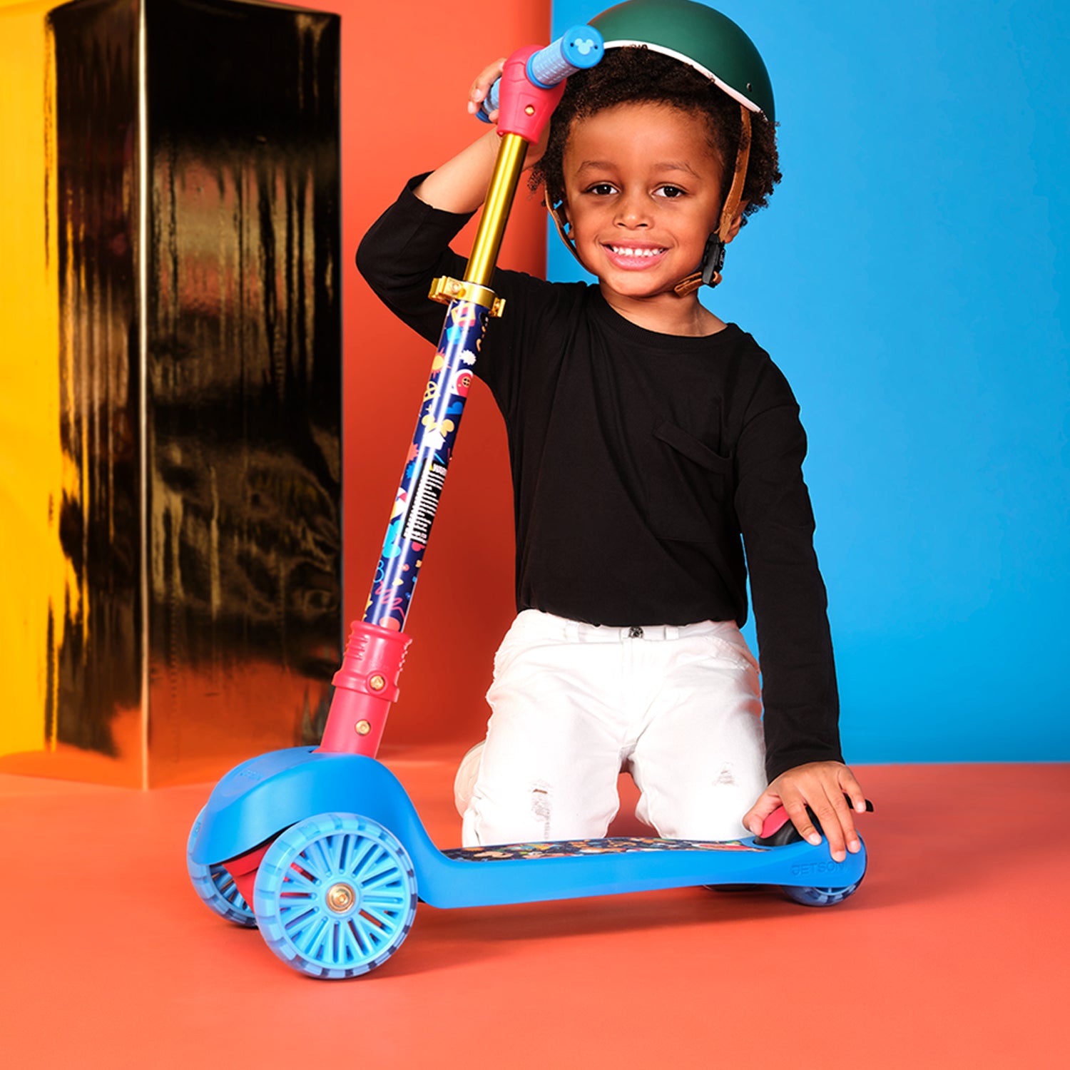 kid folding handlebar down on mickey mouse kick scooter