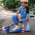 kid folding moonbeam scooter in half