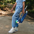 kid holding folded blue moonbeam scooter