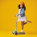 young girl riding three wheel kick scooter