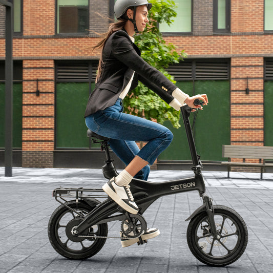 woman riding OTG elite electric bike in a city