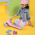 young girl putting stickers on the customizable disney princess kick scooter