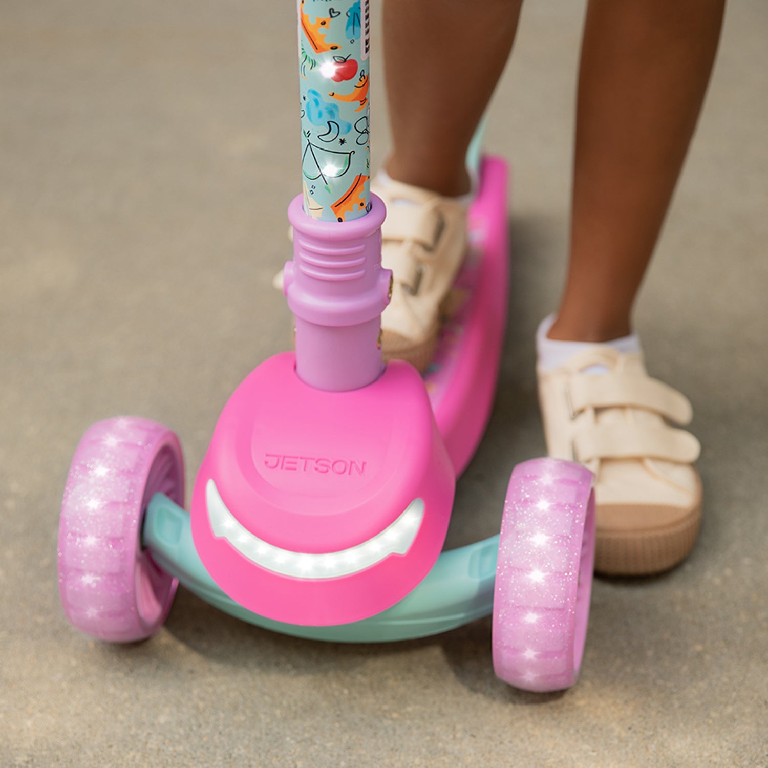 close up of front wheels and light on the princess kick scooter