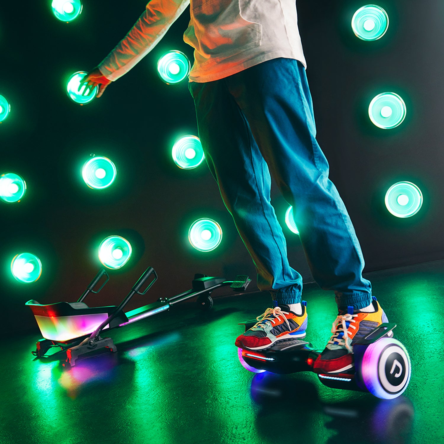 person riding hoverboard in a lit up studio
