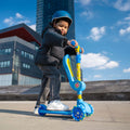 little kid riding cocomelon kick scooter