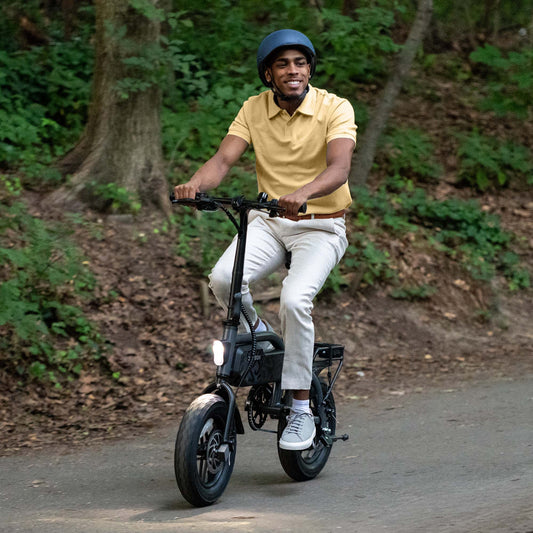 person riding shadow e-bike with headlight turned on