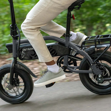 close up of person's feet on pedals of shadow e-bike
