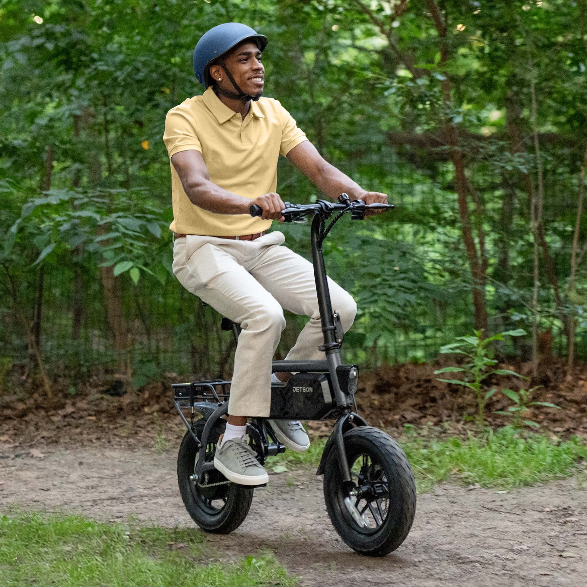 person riding shadow e-bike down a path
