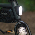 close up of headlight turned on the shadow e-bike