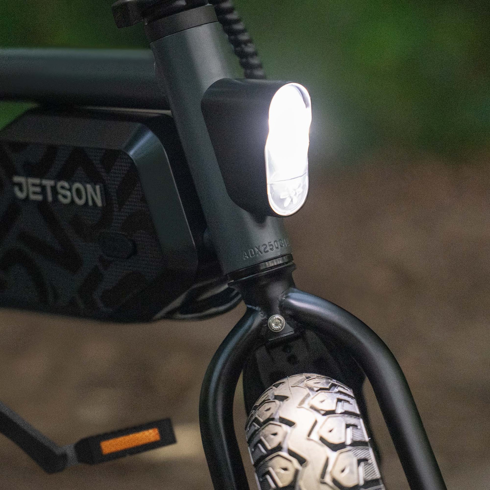 close up of headlight turned on the shadow e-bike