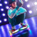 teen squatting down on the stereofly hoverboard