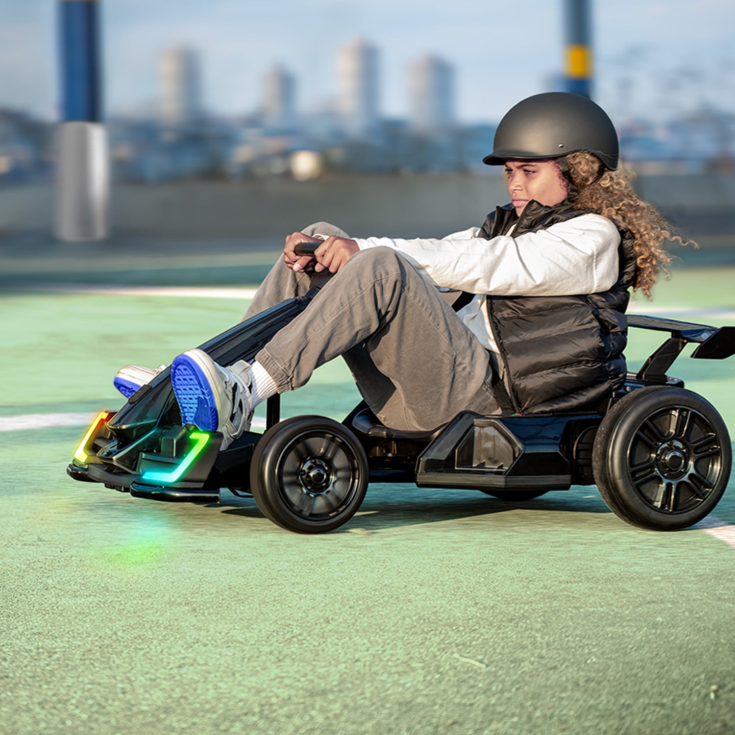 kid riding volt x electric go kart in a park