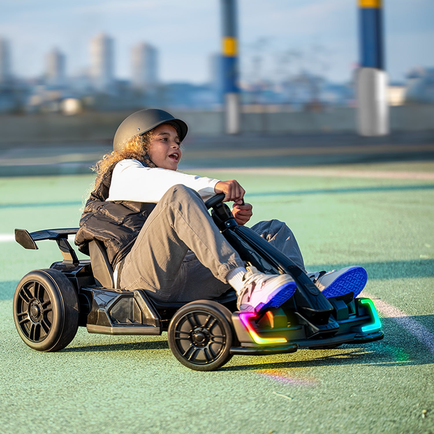 kid riding volt x electric go kart in a park