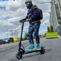 man making turn on e-scooter on street
