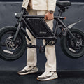 person holding the atlas electric bike by the frame