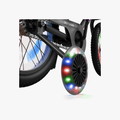 close up of training wheels on black light up bike