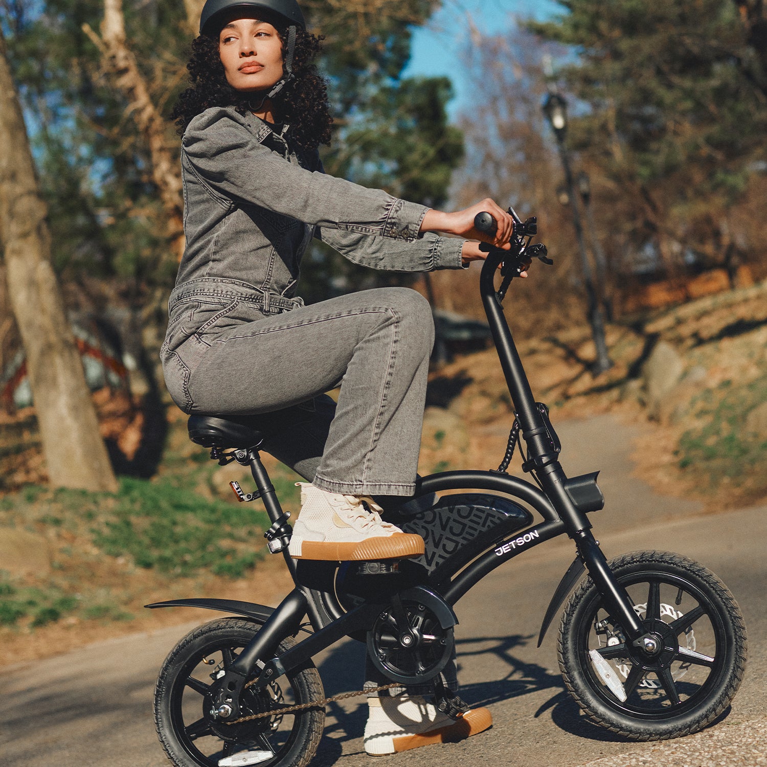 woman riding the Bolt Pro bike in a park