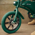 close up of front wheel and headlight on green Bolt Pro