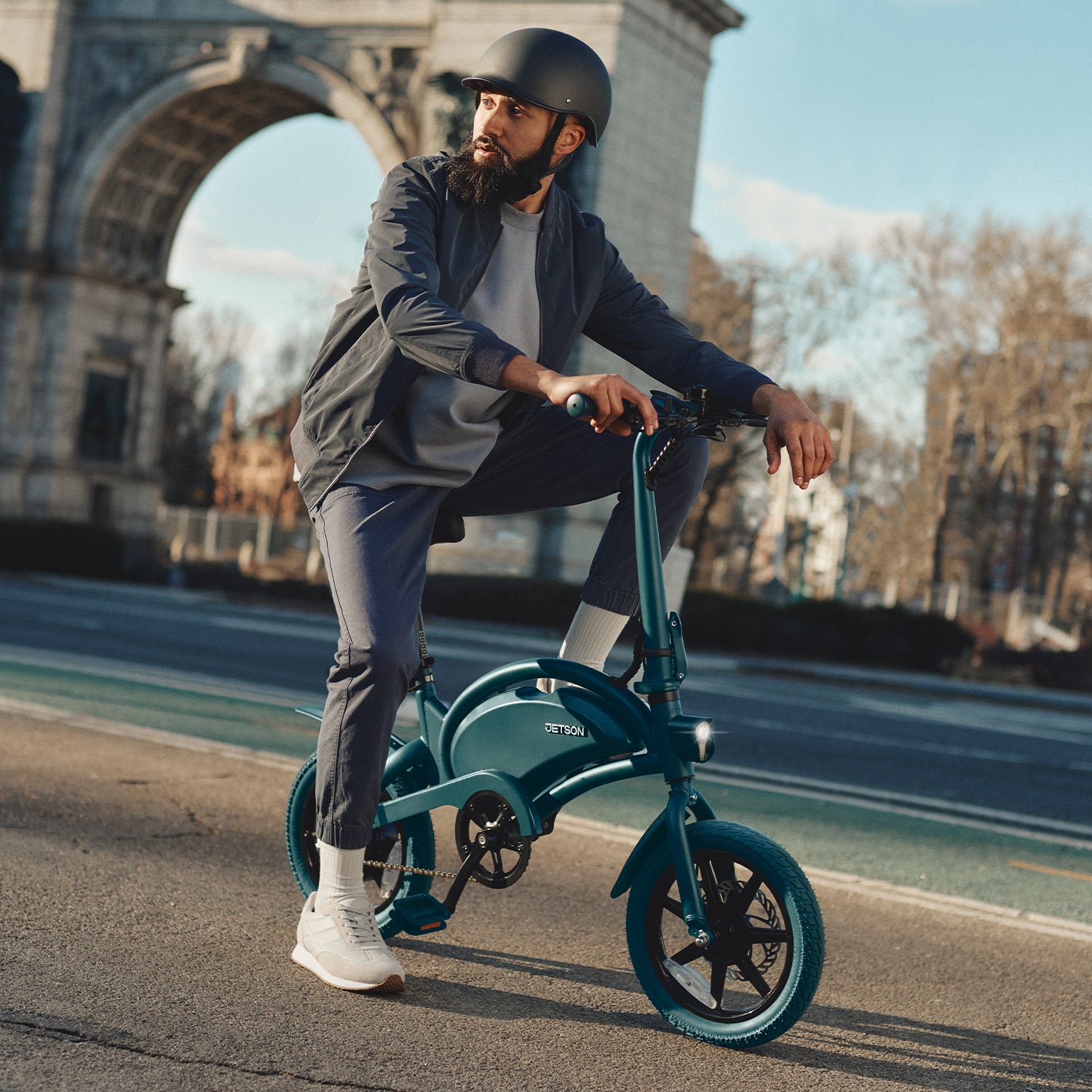 person with a helmet sitting on a Bolt Pro bike in New York City