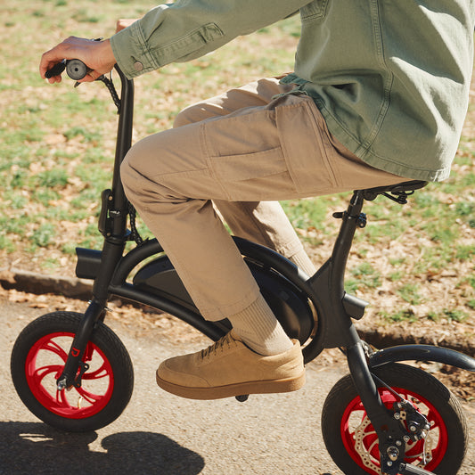 close up of person riding Bolt on a paved path