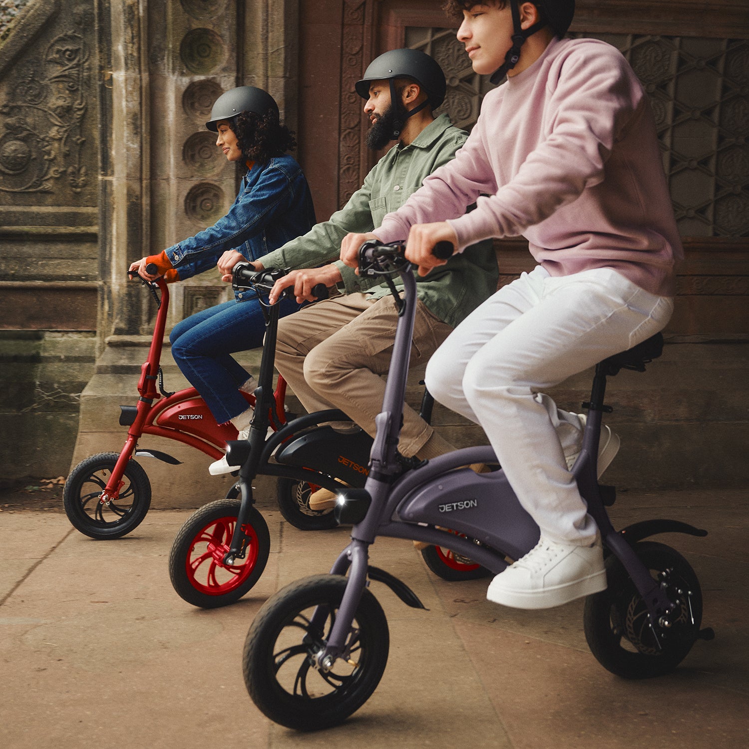 three people lined up on their Bolt bikes