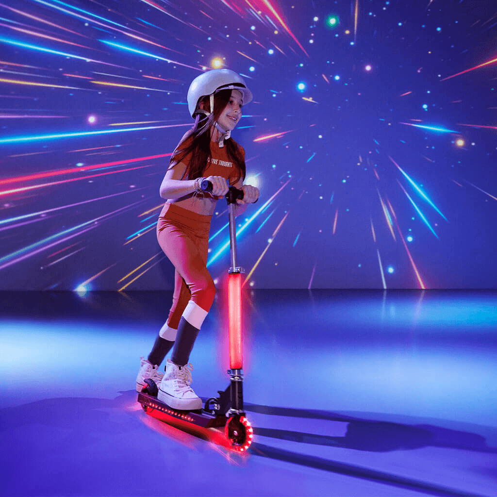 young girl riding light up cosmo kick scooter