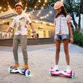 kids riding the black and pink hoverboards in front of a Shake Shack