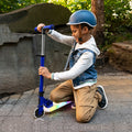 kid adjusting the handlebar height on the blue helio x kick scooter