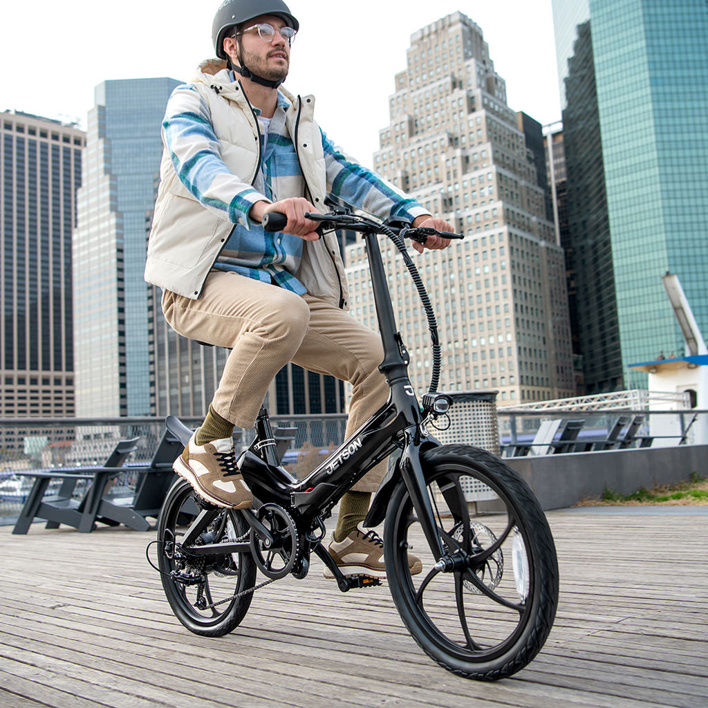 person on J8 bike on a pier in the city 